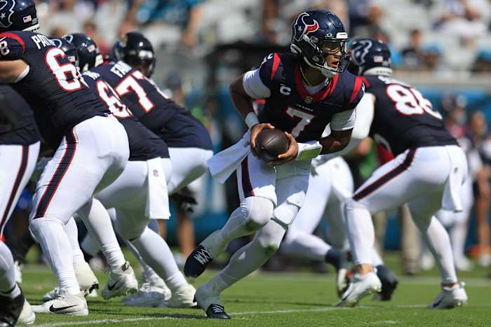 Corey Perrine/Florida Times-Unio / USA TODAY NETWORK, Texans quarterback C.J. Stroud (7) looks to handoff during the third quarter of an NFL football matchup Sunday.